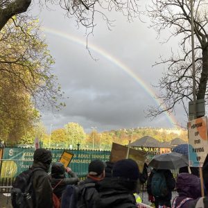 A rainbow over a march